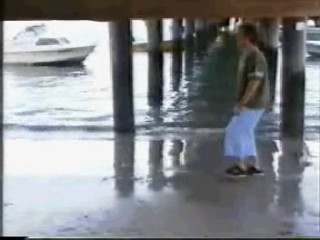 girl jumps from boat in jeans