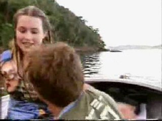girl jumps from boat in jeans
