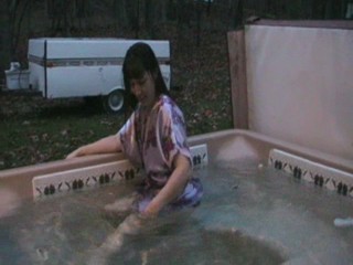 Jennifer in the hottub in her nightgown