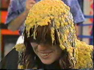 Women gets Cream Corn Poured over her head