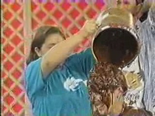 A women has chocolate poured over her head