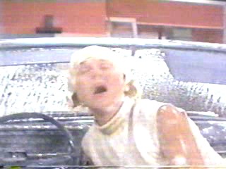 woman goes through car wash