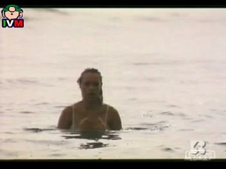 Anna Falchi wading into sea