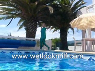 Wetlook Milf swimming in Shiny catsuit