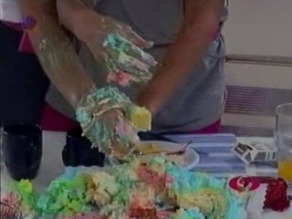 Girls Camp - A  messy cake face scene.