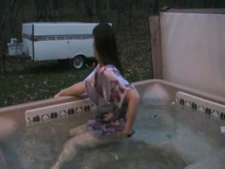 Jennifer in the hottub in her nightgown