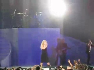 Taylor Swift performing in rain