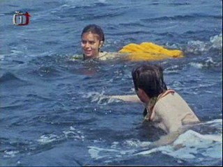 Early 80's  movie with sinking canoe